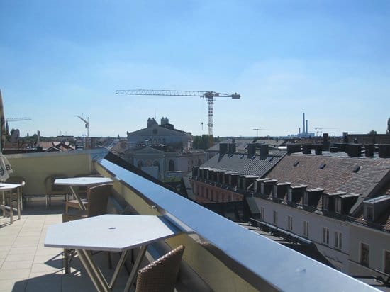 Rooftop terrace cocktail reception, urban venue construction view