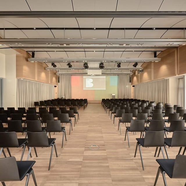 Modern conference hall, tiered seating, event, presentation