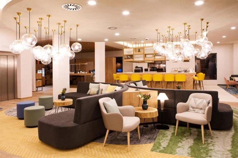 Hilton Munich Messe conference lobby, modern bar, networking event