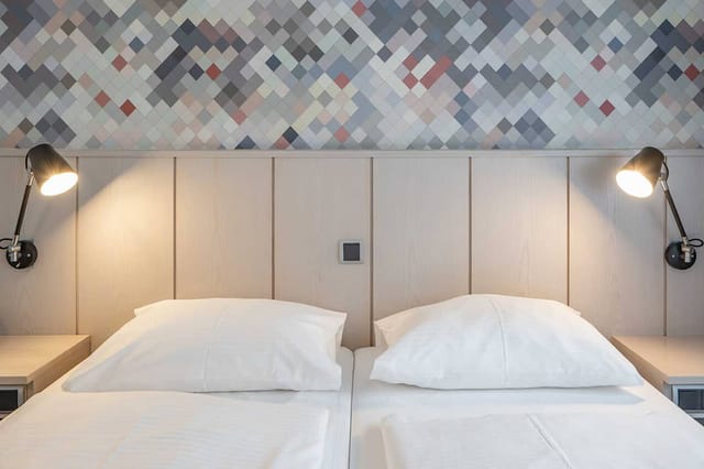 Kreativ Hotel Schiller room: Twin beds, executive retreat, VIP lodging.