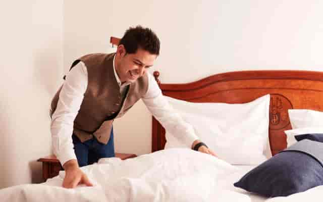 Hotel Prinzregent library, staff preparing VIP suite, delegate accommodations