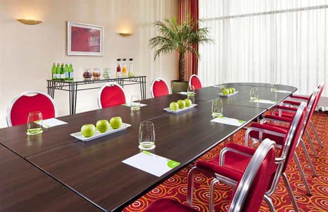 Courtyard Munich boardroom meeting, natural light, refreshments
