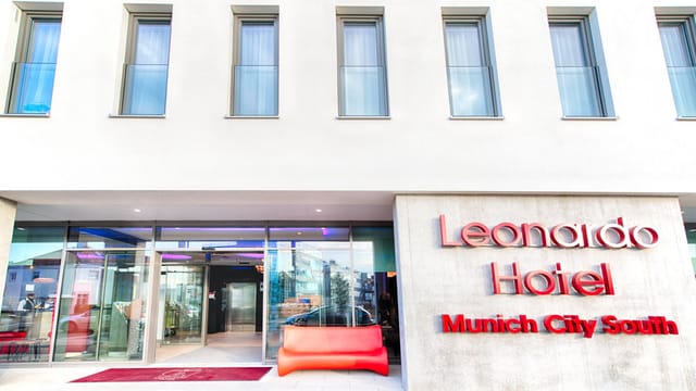 Munich hotel conference venue, modern, glass, corporate event