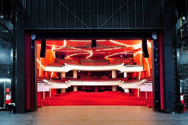 Deutsches Theater Munich stage, red accents, gala, product launch.