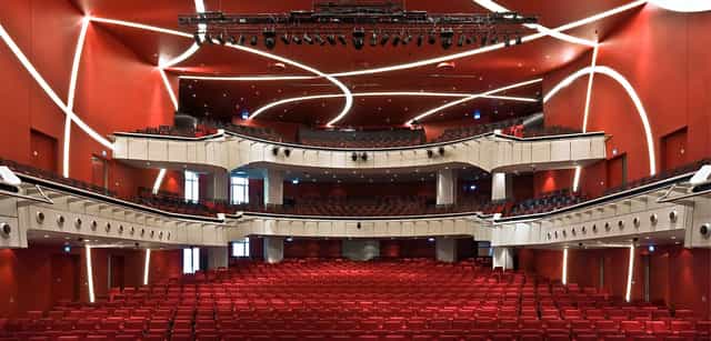 Munich theater stage, red seats, product launch event