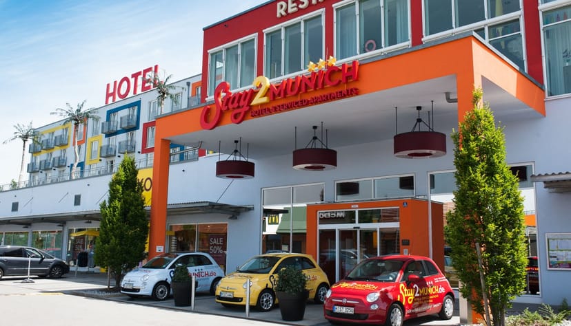 Munich hotel entrance, vibrant, budget events