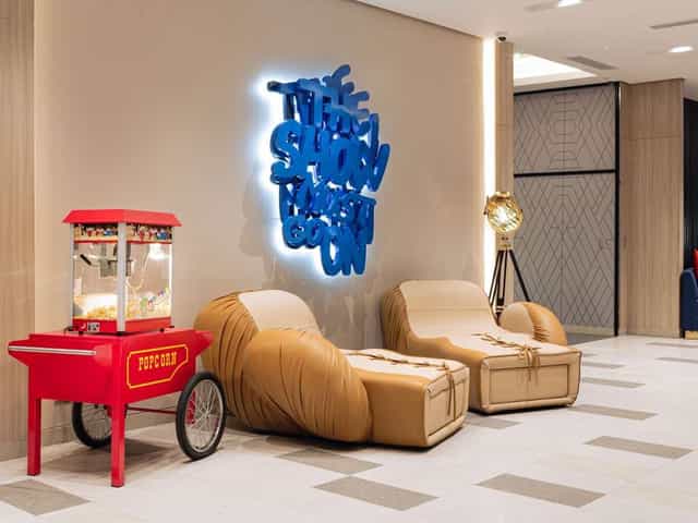 Manila hotel event lobby, graffiti sign, popcorn cart, meeting