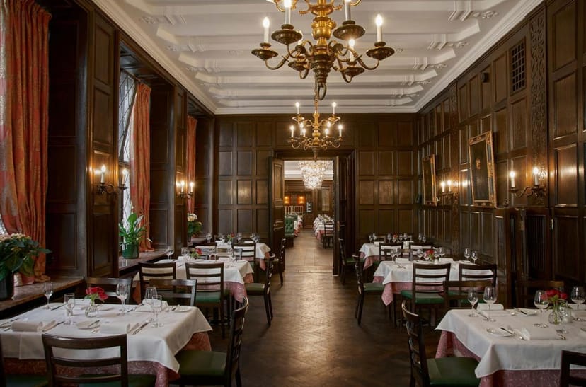 Elegant wood-paneled banquet hall, formal dining setup