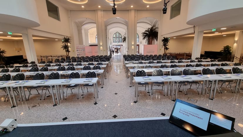 Munich conference venue, plenary hall, elegant seating.