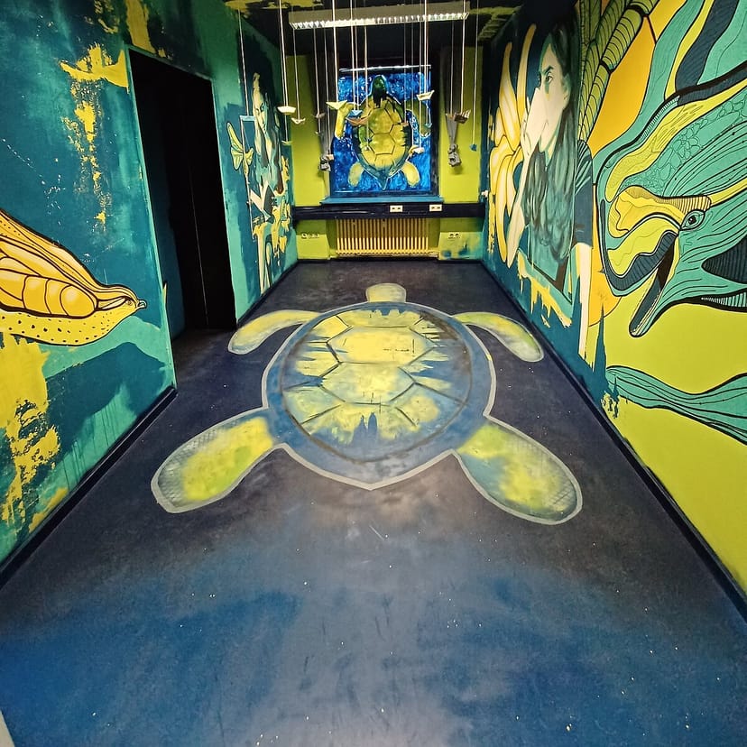 Pop-up gallery entry: vibrant art, event signage