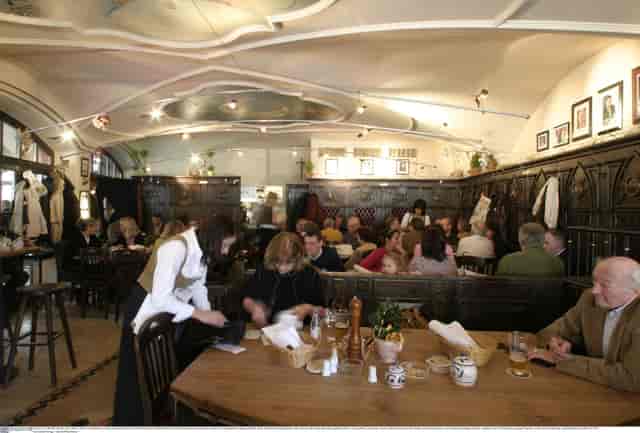 Historic Benediktiner Eck venue with wood paneling for F&B buyouts and networking mixers.