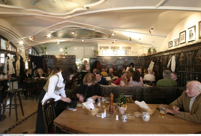 Historic Benediktiner Eck venue with wood paneling for F&B buyouts and networking mixers.
