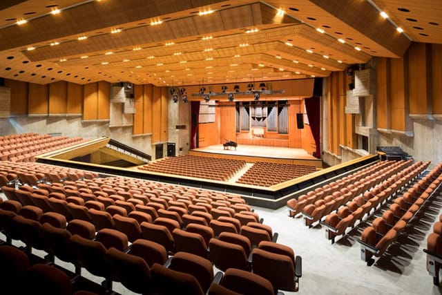 Congress Hall auditorium with wood paneling, ideal for corporate events and keynote presentations.