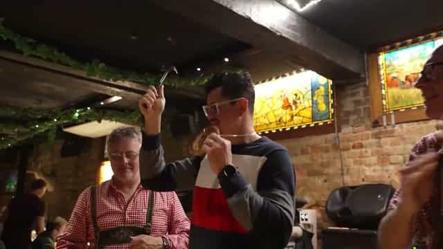 Team-building activity at Jäger Bar Munich Brauhaus, rustic corporate offsite venue.