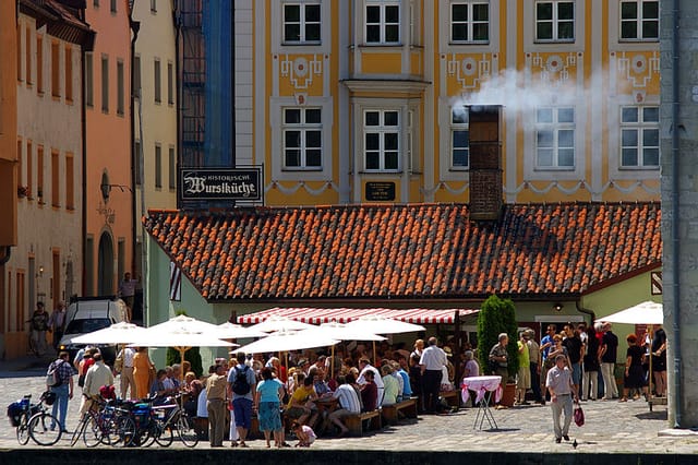 Outdoor café at Historische Wurstkuchl for event catering and social gathering venue.