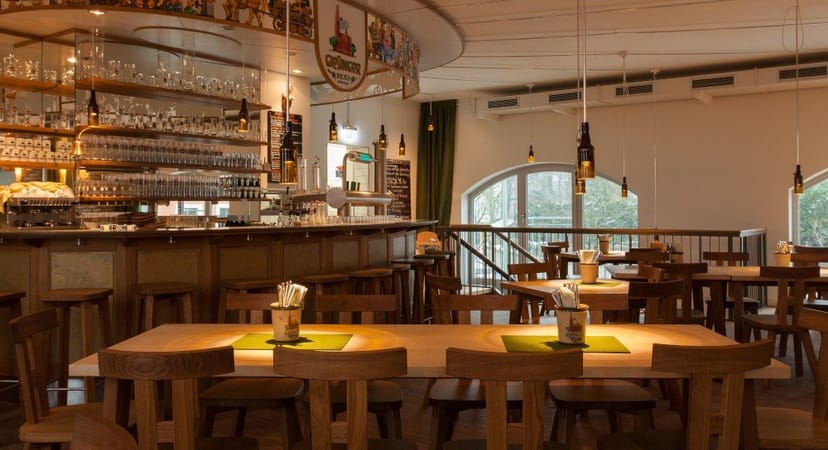 Rustic Bräustüberl venue with wooden seating for networking events and team dinners.