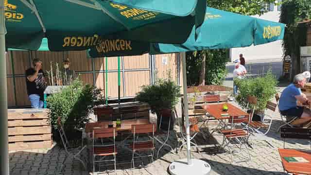Rustic Giesinger Bräu event space with pallet seating for networking and corporate breakout events.
