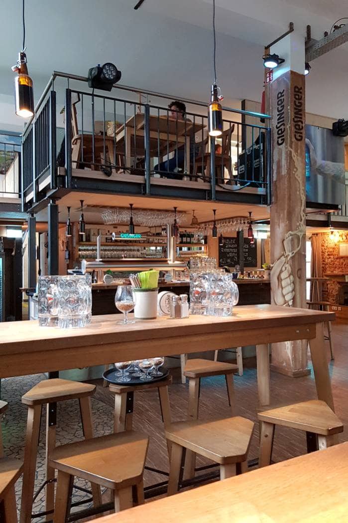 Industrial-chic Giesinger Bräu Schänke venue for evening receptions and networking events.