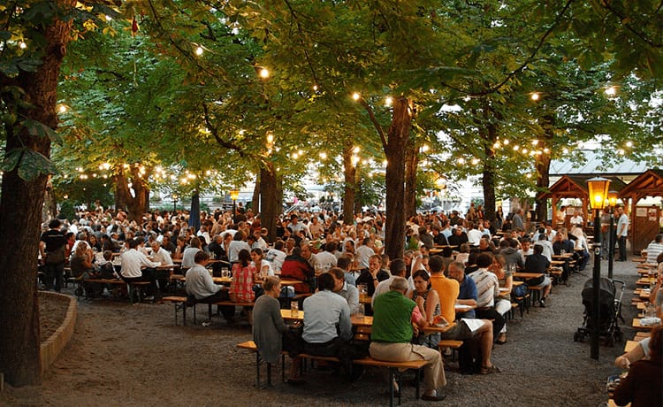 Gasthaus Domagk beer garden with communal benches, ideal for networking and corporate events.