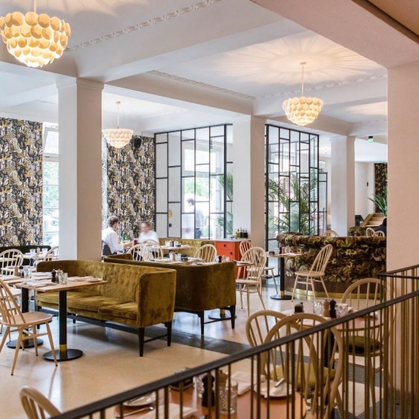 Lounge at Café Reitschule with velvet seating, perfect for corporate luncheons and networking.