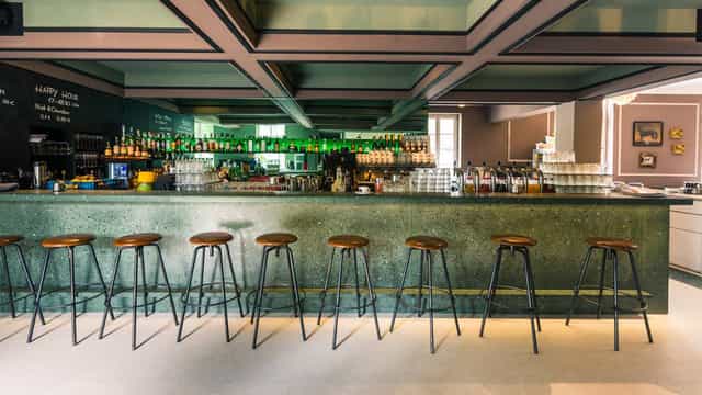Industrial café lounge for corporate happy hour or professional networking mixer.