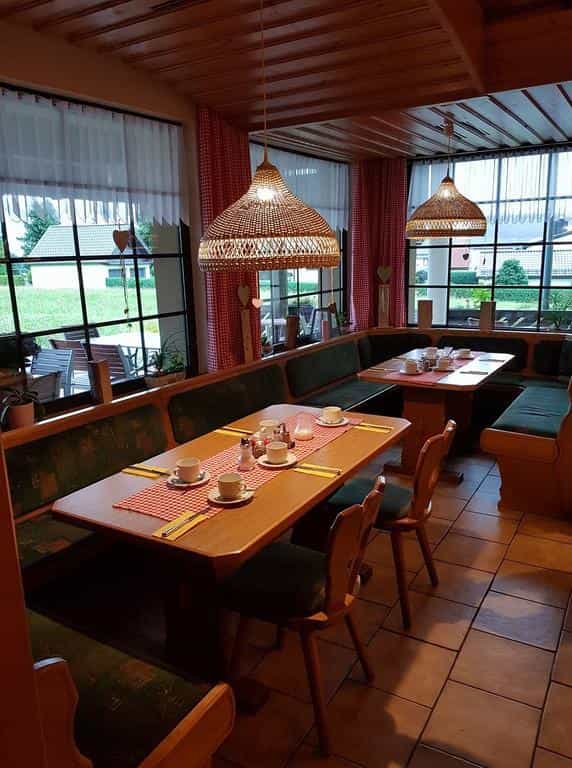 Rustic booth seating at Berggasthof & Hotel Kranich, ideal for networking and team meetings.