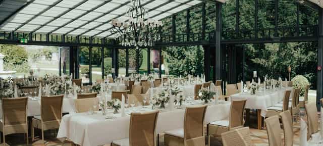 Glass conservatory function room in LA VILLA for corporate dinners and social events.