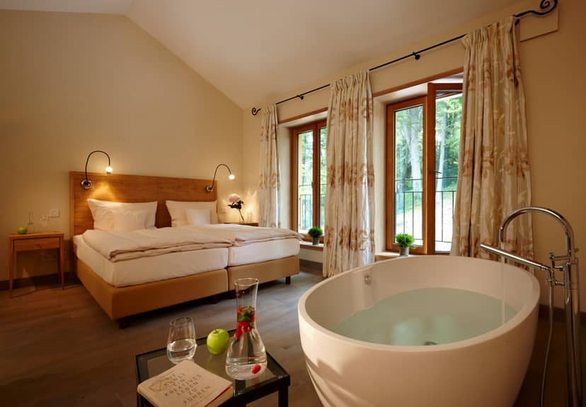 Luxury hotel guest room with soaking tub for executive retreats and incentive travel.