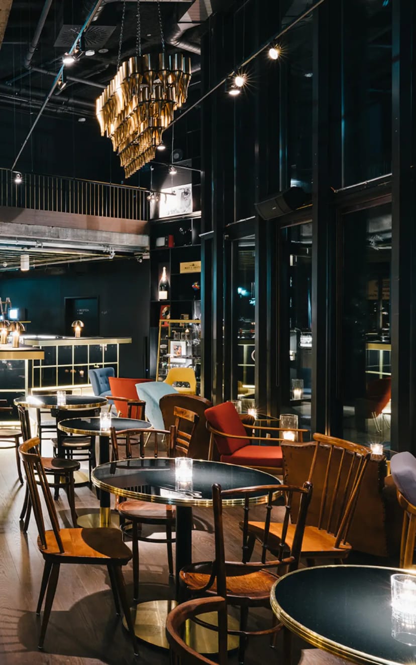 Modern cafe lounge with industrial decor for corporate receptions and networking events.