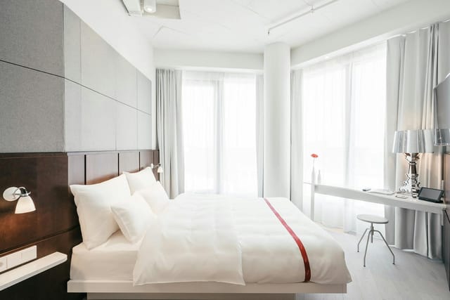 Modern Ruby Lilly hotel guest room for corporate travel and conference stay.