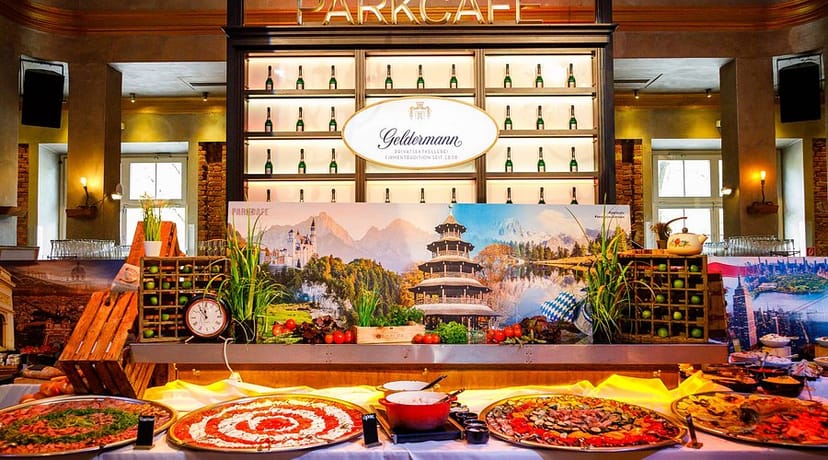 König Ludwig buffet with rustic decor and custom branding for high-end corporate event catering.