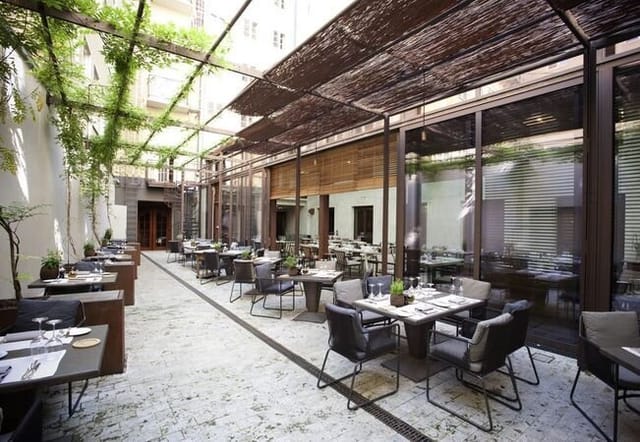 Covered garden terrace venue for networking receptions and private luncheons.