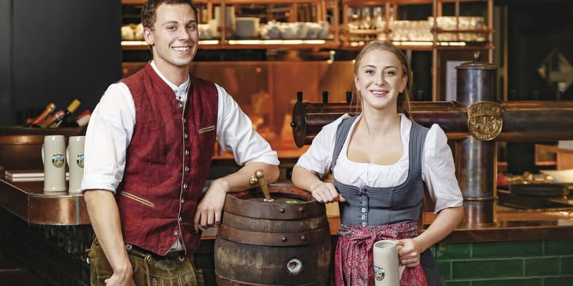 Bavarian-style corporate reception team in thematic attire at Kreszenz4, Ayinger in der Au.