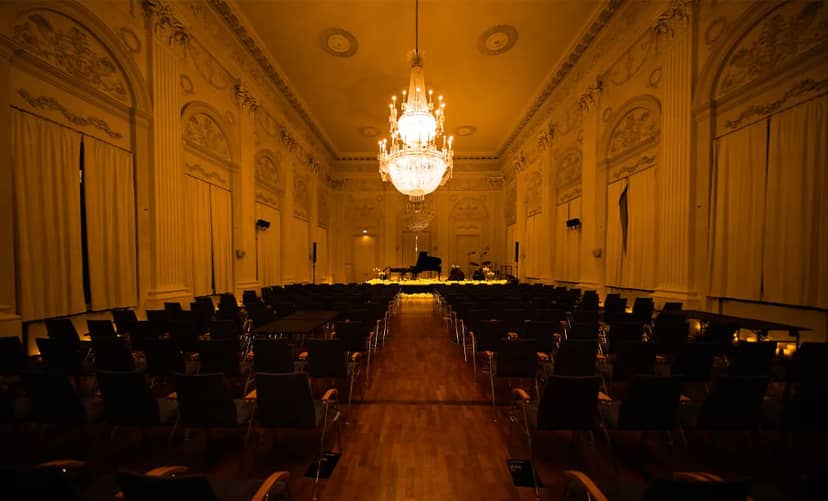 Max-Joseph-Saal ballroom with grand chandelier for luxury corporate events and intimate recitals.