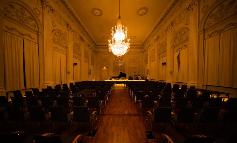 Max-Joseph-Saal ballroom with grand chandelier for luxury corporate events and intimate recitals.