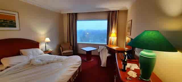 Pullman Bucharest hotel room workspace for business conference event lodging.