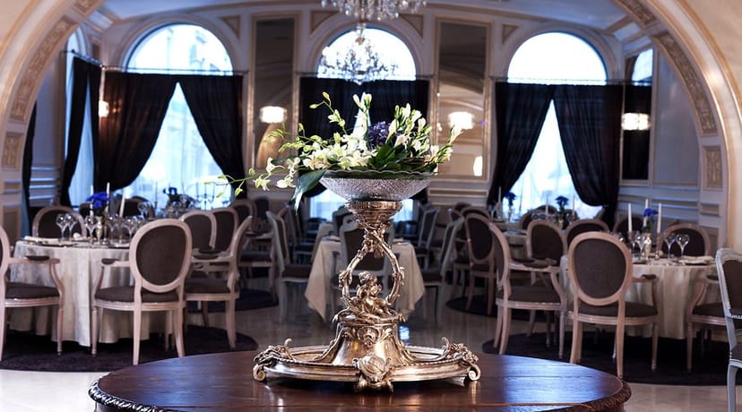 Concerto Fine Dining banquet setup with silver centerpieces for upscale gala or formal dinner.