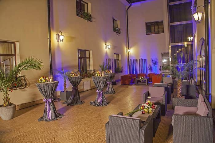 Hotel Trianon cocktail reception space with bistro tables and lounge seating for corporate events.