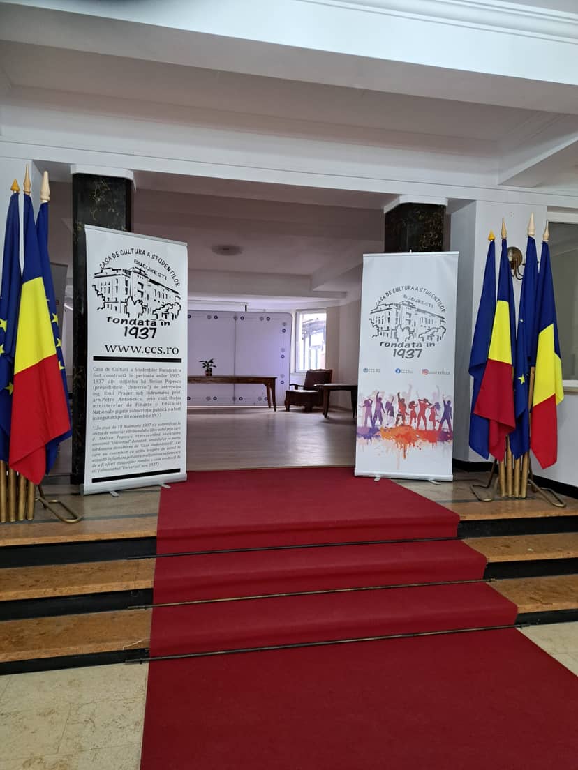 Conference room venue with red-carpet entrance for professional business events and workshops.
