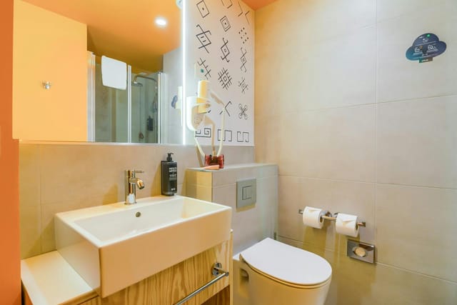 Modern hotel bathroom with vessel sink for Ibis Styles Bucharest City Center event accommodation.