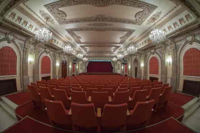Cercul Militar National theater with fixed seating for keynote events and awards galas.
