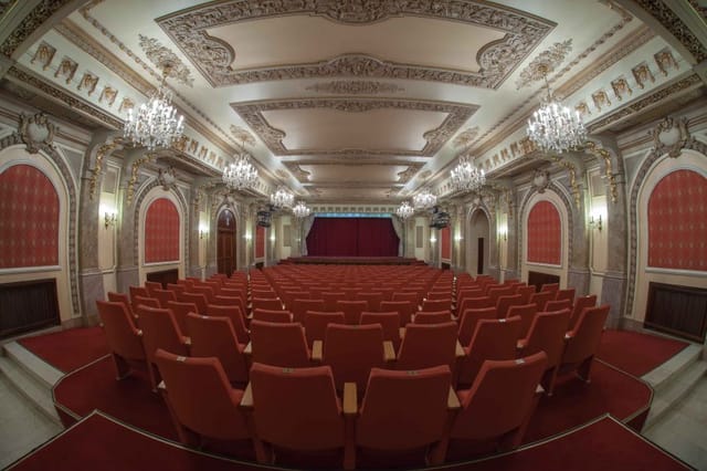 Cercul Militar National theater with fixed seating for keynote events and awards galas.