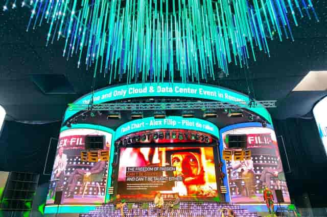 Face Summer stage design with LED screens and fiber-optic ceiling for tech conferences.