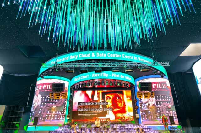 Face Summer stage design with LED screens and fiber-optic ceiling for tech conferences.