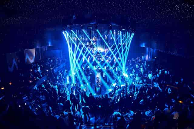 Face Club Bucharest gala event with dramatic circular lighting and star-field ceiling.