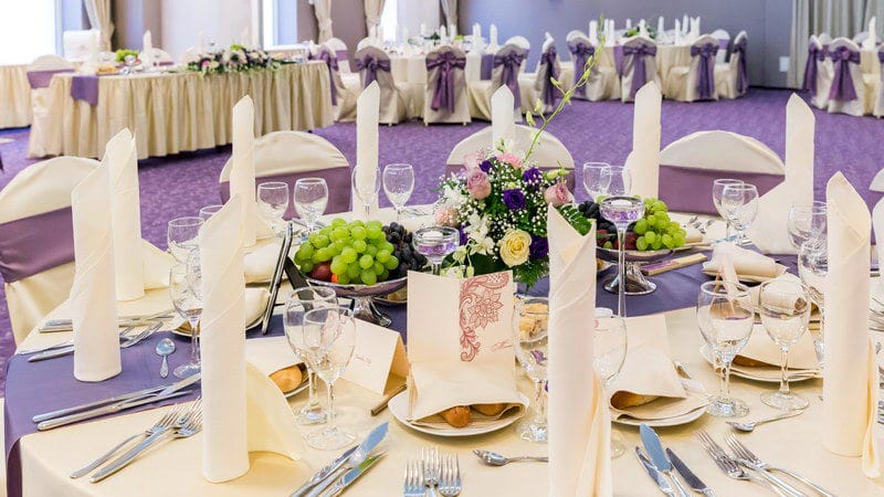 Banquet hall at Hotel Minerva with purple sashes, perfect for formal weddings and gala events.