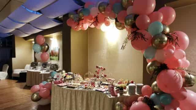 Dessert station with balloon arch at Hotel Minerva Himalaya Ballroom for weddings and gala events.