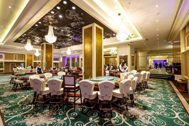Opulent Palace Casino bar with grand chandeliers for upscale corporate events and casino nights.
