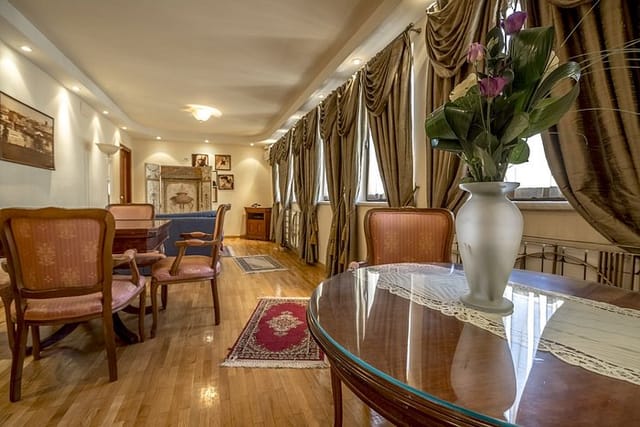 Hotel Opera boardroom suite with glass table, ideal for strategy sessions and high-level meetings.