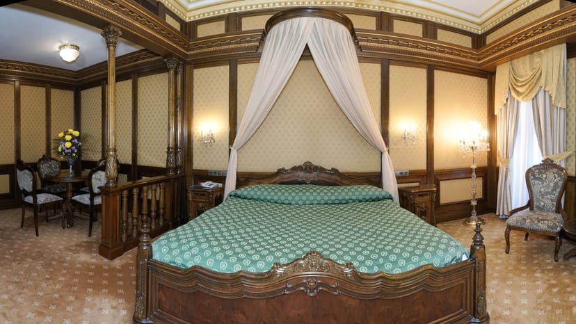 Luxury suite at Casa Capsa Hotel, period-style decor for VIP accommodation and private boardroom.